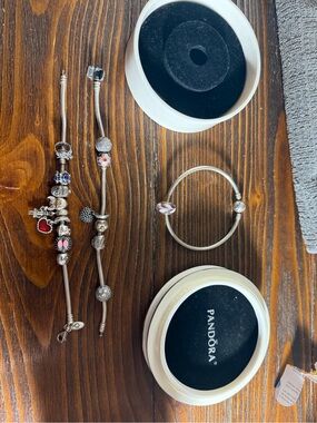 Three Pandora Silver Charm Bracelets with 16 Silver, Pink and Red Accents charms